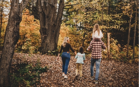 family walking in woods